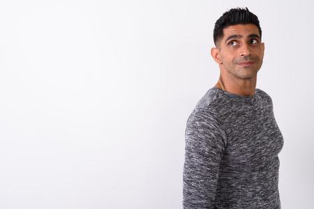 Young muscular Persian man against white backgroundの写真素材