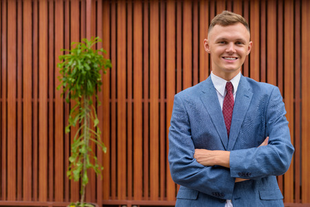 Portrait of young businessman in the streets outdoors