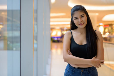 Young beautiful Asian woman exploring around the cityの写真素材
