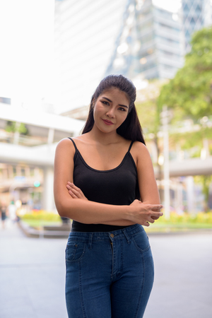 Young beautiful Asian woman exploring around the cityの写真素材