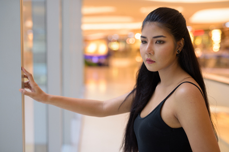 Young beautiful Asian woman exploring around the cityの写真素材