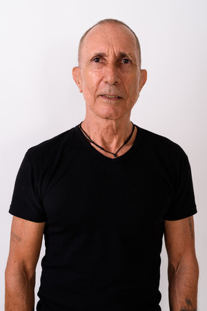 Bald senior man standing against white backgroundの写真素材