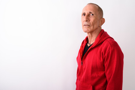 Bald senior man standing against white backgroundの写真素材