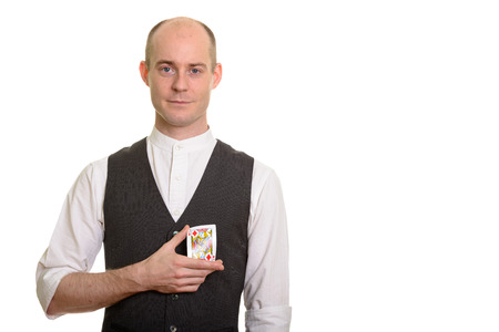 Bald Caucasian magician man bending Jack of Diamonds card