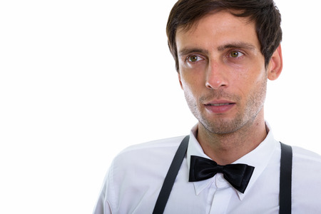 Close up of young handsome man thinking while wearing suspendersの写真素材