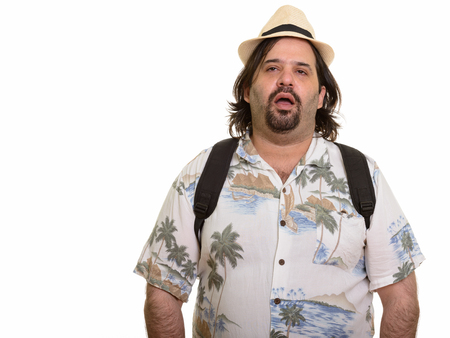 Fat Caucasian man looking tired ready for vacationの写真素材