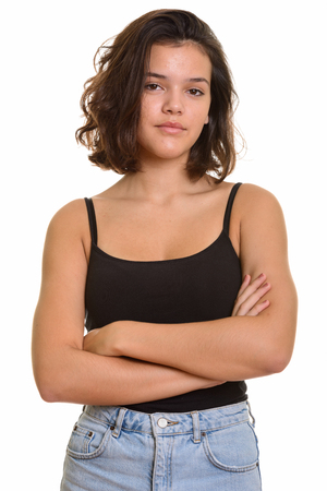 Portrait of young beautiful Caucasian teenage girl with arms crossedの写真素材