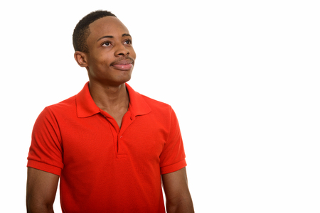 Young African man thinking isolated against white backgroundの写真素材