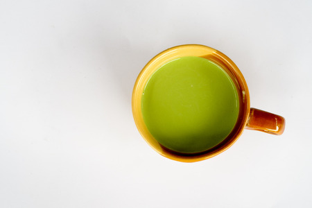 Green Matcha Tea With Milk On White Tableの写真素材
