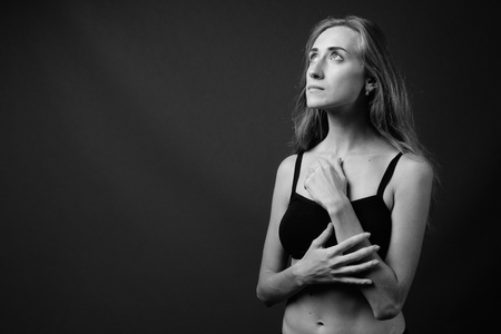 Young beautiful woman ready for gym in black and whiteの写真素材