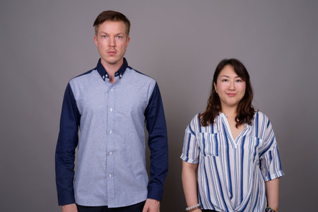 Portrait of multi ethnic diverse couple in studioの写真素材