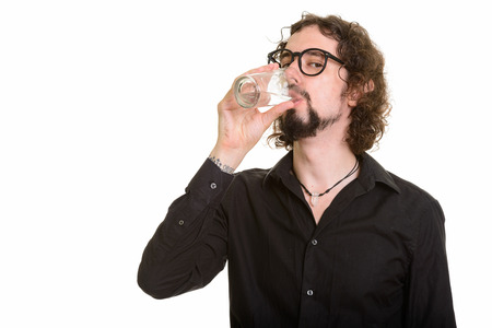 Portrait of handsome Caucasian man drinking water