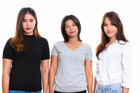 Studio shot of three young Asian woman friendsの写真素材