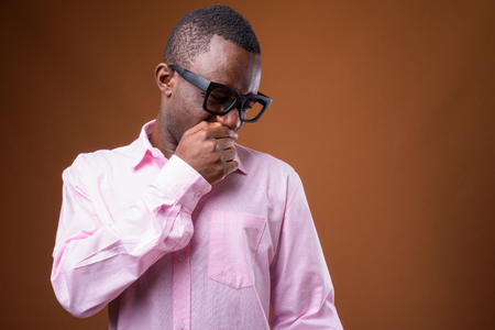 Portrait of young African businessman looking disgustedの写真素材