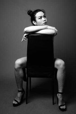Young beautiful Asian transgender woman in black and whiteの写真素材