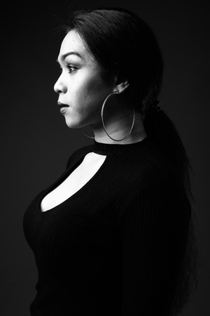 Young beautiful Asian transgender woman in black and whiteの写真素材