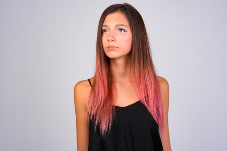 Young beautiful woman thinking and looking awayの写真素材