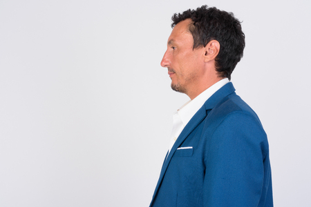 Profile view of mature businessman against white backgroundの写真素材