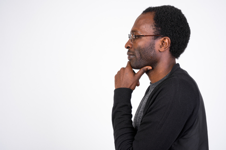 Profile view of African man with eyeglasses thinkingの写真素材