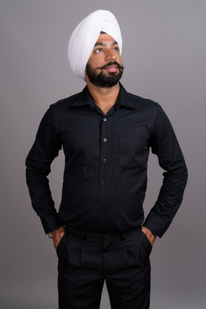 Young Indian Sikh businessman wearing white turbanの写真素材