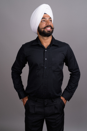 Young Indian Sikh businessman wearing white turbanの写真素材