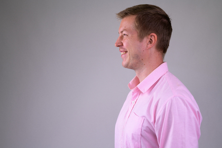 Profile view of happy young businessman smilingの写真素材