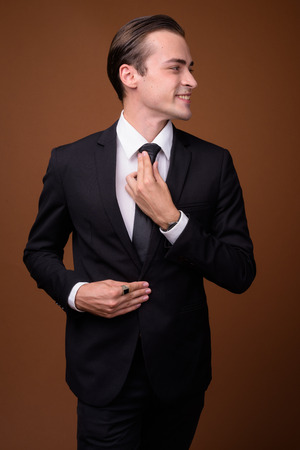 Portrait of young happy Caucasian businessman smilingの写真素材