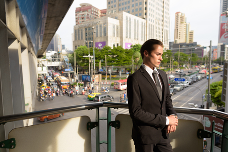 Young businessman exploring the city of Bangkok, Thailandの写真素材