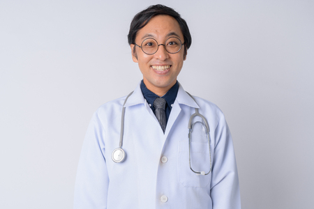 Portrait of happy Japanese man doctor smilingの写真素材