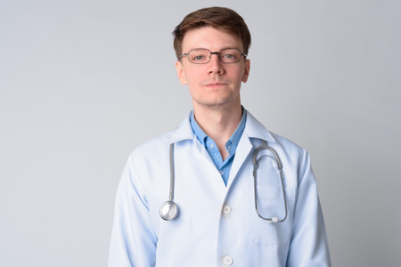 Portrait of young handsome man doctor with eyeglassesの写真素材
