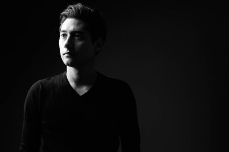 Young multi-ethnic handsome man in black and white