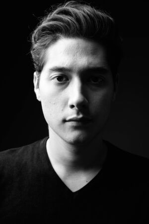 Young multi-ethnic handsome man in black and whiteの写真素材