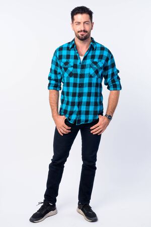 Full body shot of young handsome bearded hipster manの写真素材