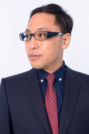 Face of Japanese businessman in suit thinkingの写真素材
