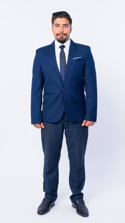 Full body shot of bearded Persian businessmanの写真素材