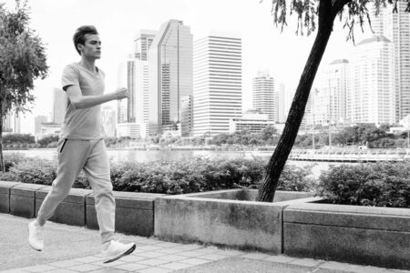 Young handsome man jogging at the parkの写真素材