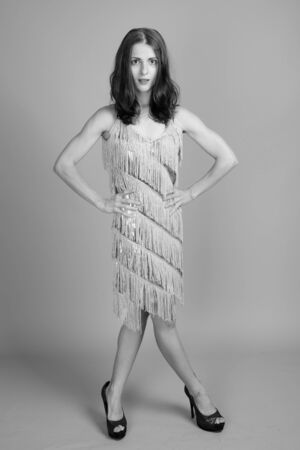 Studio shot of young beautiful woman in black and white
