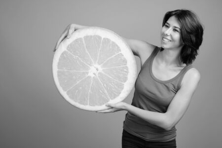 Portrait of young beautiful woman shot in black and whiteの写真素材