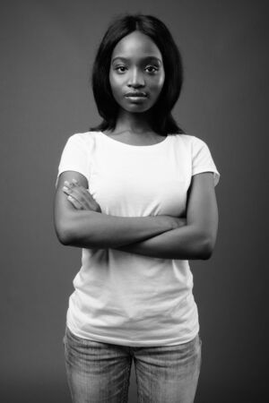 Young beautiful African Zulu woman against brown backgroundの写真素材