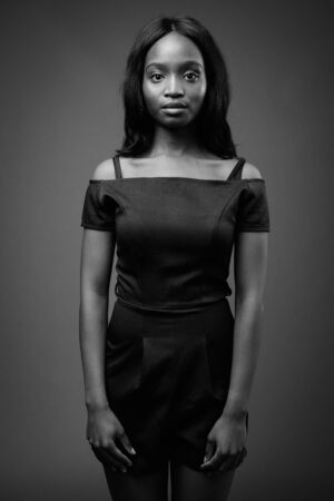 Young beautiful African Zulu woman against brown backgroundの写真素材