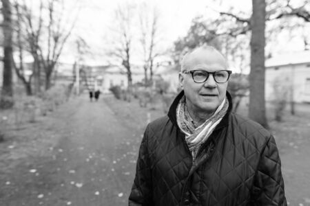 Mature handsome man enjoying life around the city of Turku, Finland