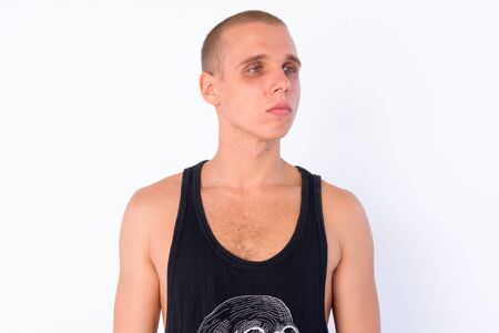 Face of young bald rebellious man thinking and looking away