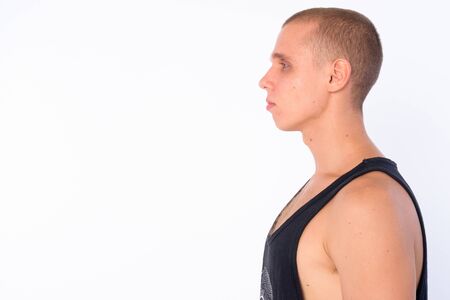 Closeup profile view of young bald rebellious manの写真素材