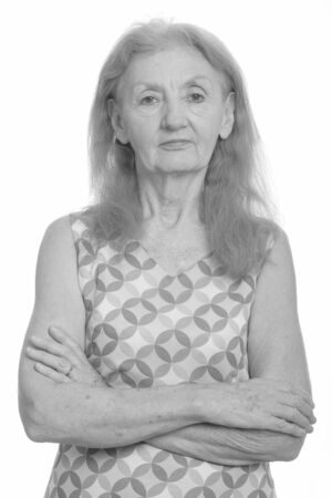 Studio shot of senior woman with arms crossedの写真素材