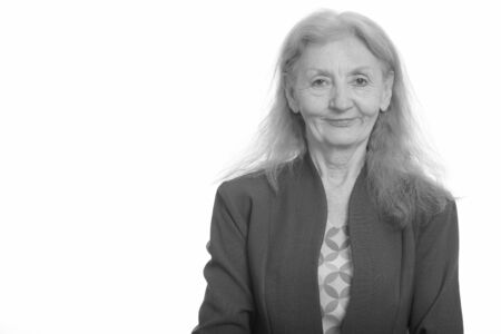 Studio shot of senior businesswoman in black and white