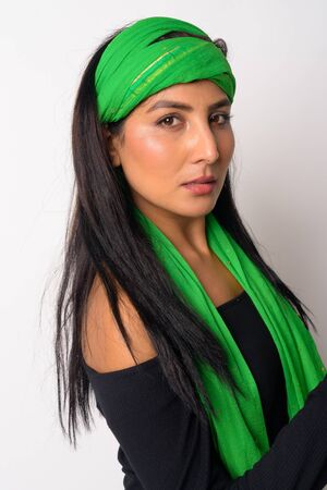 Face of young beautiful Persian woman with head scarfの写真素材