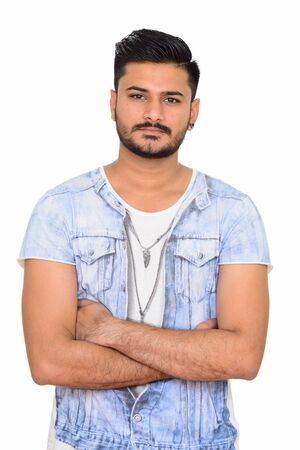 Studio portrait of handsome Indian man with beard