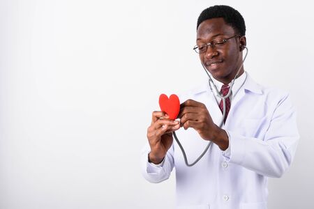 Young handsome African man doctor wearing eyeglasses against whi