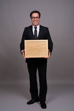 Full body shot of handsome Persian businessman in suitの写真素材