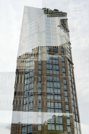 Portrait Of Tall Corporate Buildings In Multiple Exposure